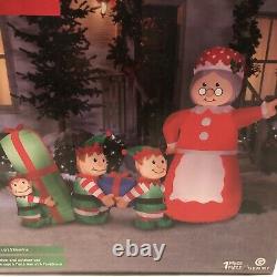 GEMMY Inflatable Mrs. Claus In Charge Scene Elves Elf Boss 7.5 ft Wide Lights Up