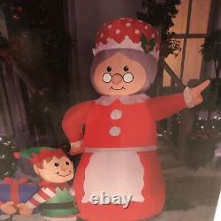 GEMMY Inflatable Mrs. Claus In Charge Scene Elves Elf Boss 7.5 ft Wide Lights Up