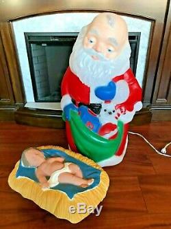 TPI Christmas Blow Mold Kneeling Santa with Baby Jesus Lighted Yard Decorations