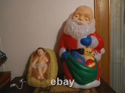 TPI. Kneeling Santa Blow Mold WithBaby Jesus blow mold yard light