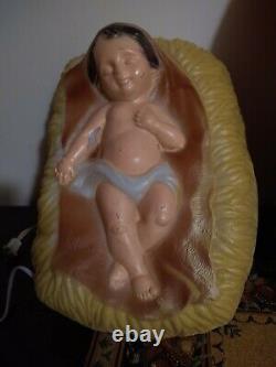 TPI. Kneeling Santa Blow Mold WithBaby Jesus blow mold yard light