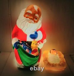 Vintage TPI. Kneeling Santa Blow Mold 27 WithBaby Jesus blow mold yard light